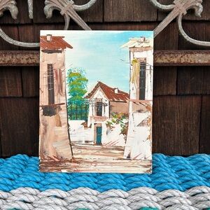Oil painting of a rustic Spanish village on board measures 8.5 by 7 inches.